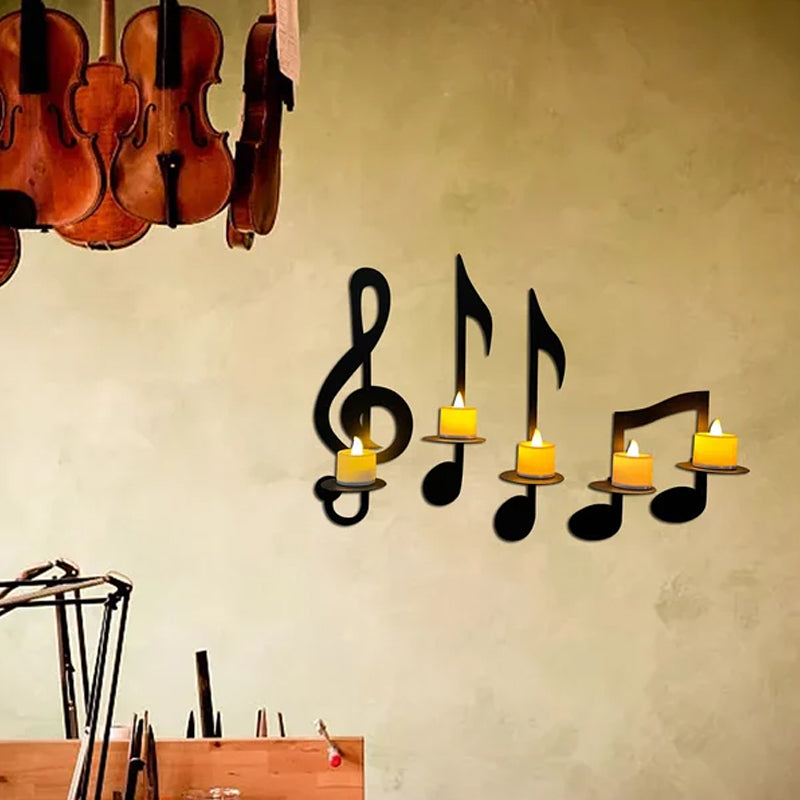 "Elegant svart metall väggmonterad musiknot ljusstake; kombinerar musikinspirerad design med stilfull dekoration."