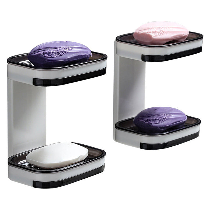 "Elegant svart och grå tvålkopp med avtappningsbricka, stilren design, glansig bakgrund, perfekt för badrumshylla."