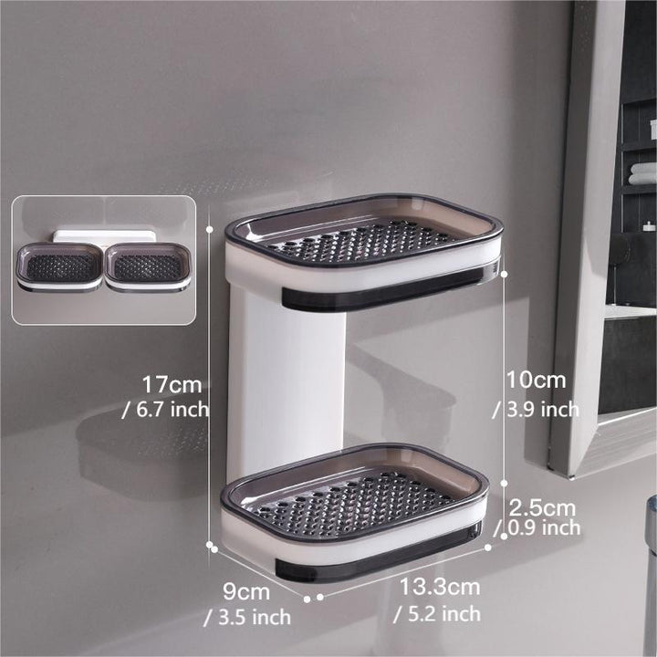 "Elegant svart och grå tvålkopp med avtappningsbricka, stilren design, glansig bakgrund, perfekt för badrumshylla."