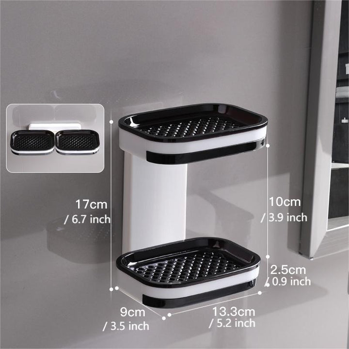 "Elegant svart och grå tvålkopp med avtappningsbricka, stilren design, glansig bakgrund, perfekt för badrumshylla."