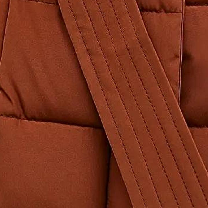 Stilren damjacka: Modern och elegant pufferjacka för damer, perfekt ytterplagg som kombinerar mode med funktion.