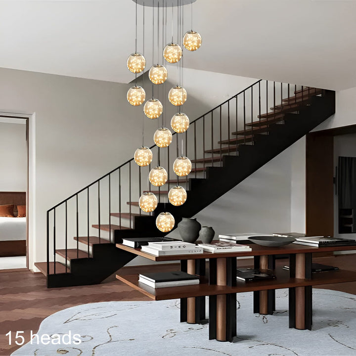 Modern design taklampa med svävande glasglober, konstnärlig touch för exklusiva hem.