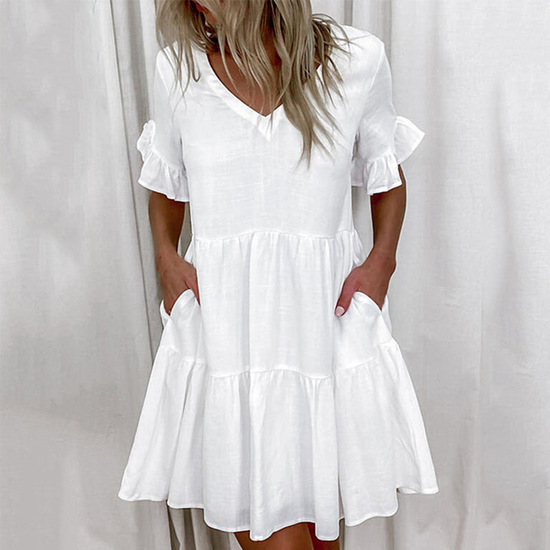 "Elegant V-ringad sommarklänning i mjukt nylon, vit färg. Perfekt för kvinnor, chic stil och ledig passform."