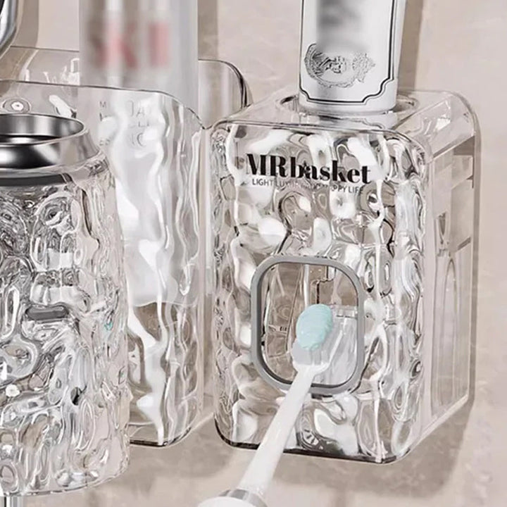 "Elegant väggmonterad tandborsthållare med munsköljkopp i silver/grå, sparar plats och håller badrummet organiserat."