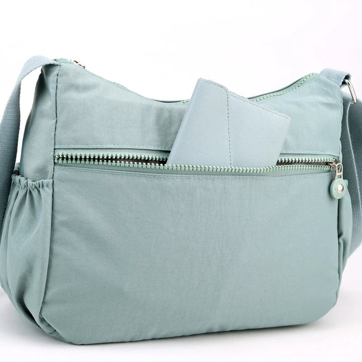 Kvinnors vattentät messenger, elegant och rymlig axelremsväska som modeaccessoar.