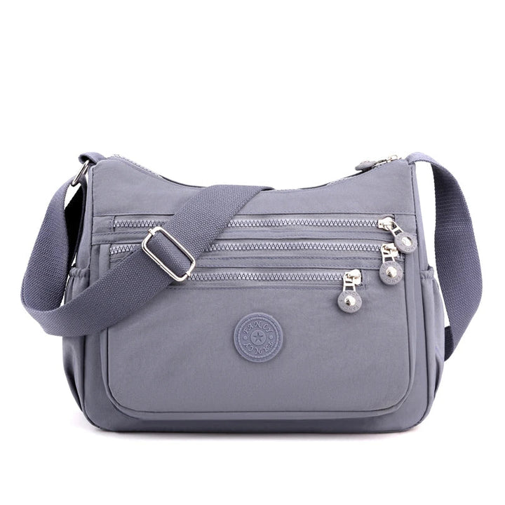 Modern handväska för kvinnor, vattentät och praktisk crossbody messenger väska.