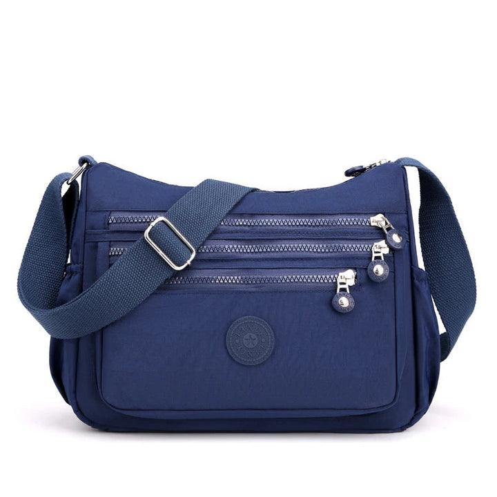 Kvinnors vattentät messenger väska, praktisk crossbody med stilren design.