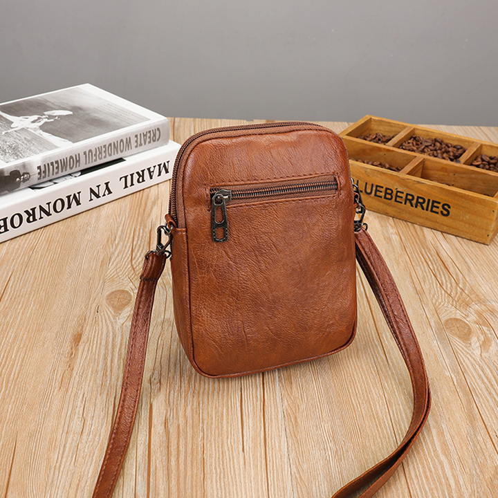"Elegant vintage mini crossbody-väska i PU-läder, svart och kompakt, perfekt för kvinnor som söker stil och funktion."