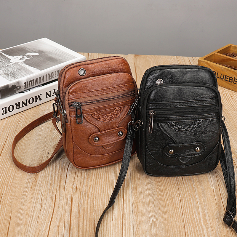 "Elegant vintage mini crossbody-väska i PU-läder, svart och kompakt, perfekt för kvinnor som söker stil och funktion."