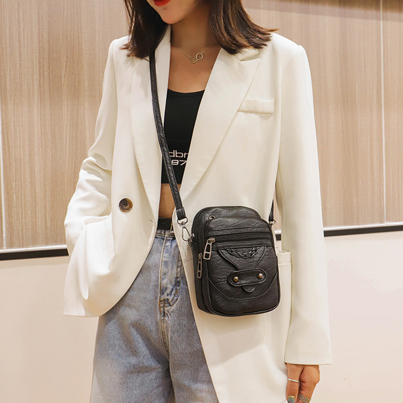 "Elegant vintage mini crossbody-väska i PU-läder, svart och kompakt, perfekt för kvinnor som söker stil och funktion."