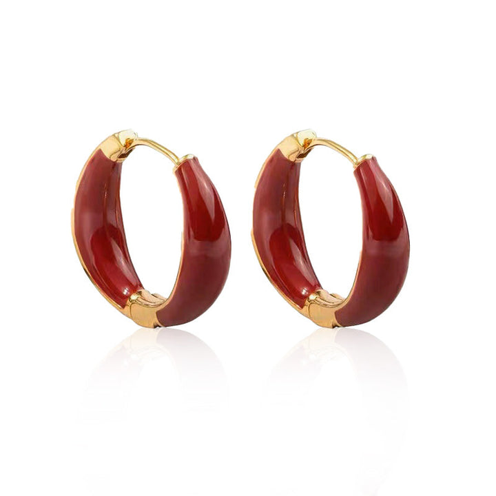 "Eleganta hoops-örhängen i koppar, skimrande och tidlös design, perfekta som kvinnors accessoarer vid alla tillfällen."
