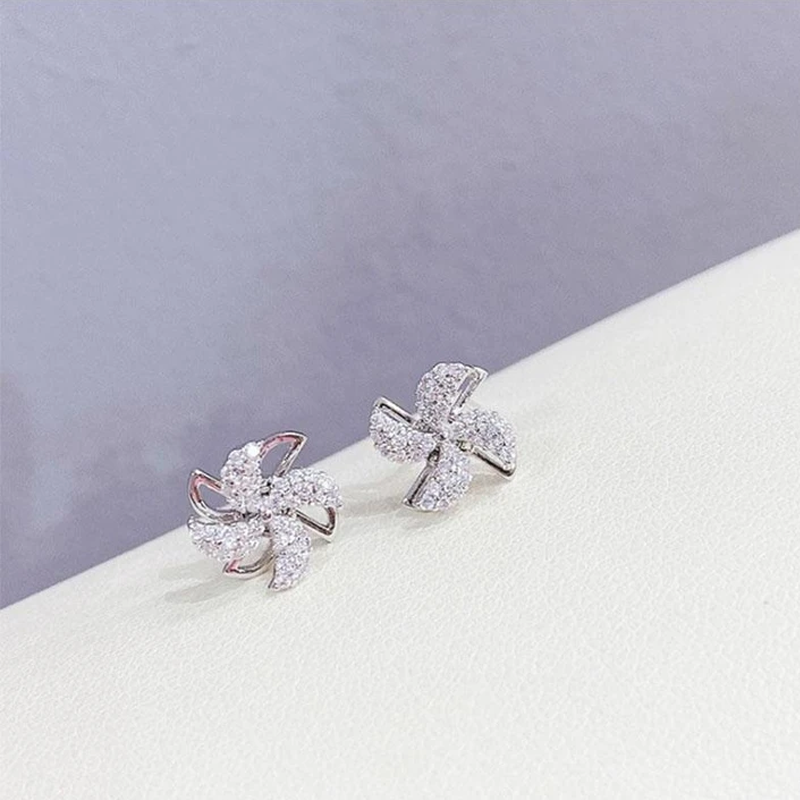 "Eleganta roterande väderkvarnörhängen i koppar och zirkon för kvinnor, gyllene eller silver, 1,1 cm, unika design."