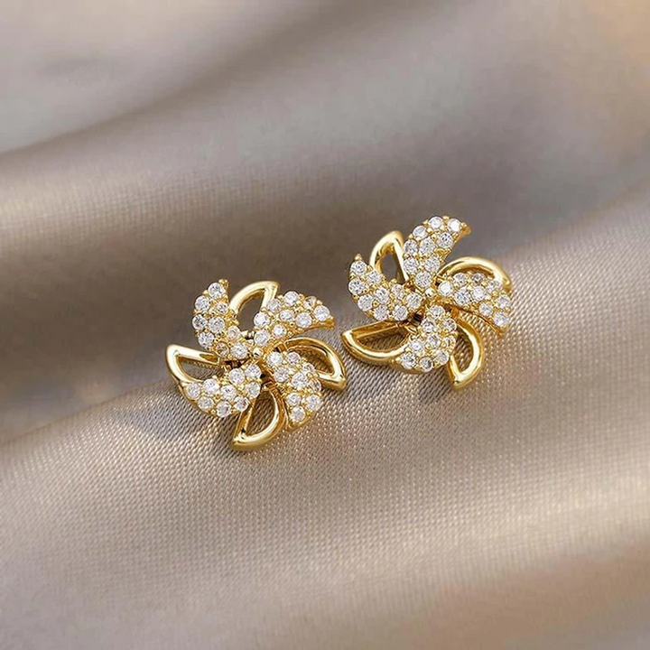 "Eleganta roterande väderkvarnörhängen i koppar och zirkon för kvinnor, gyllene eller silver, 1,1 cm, unika design."
