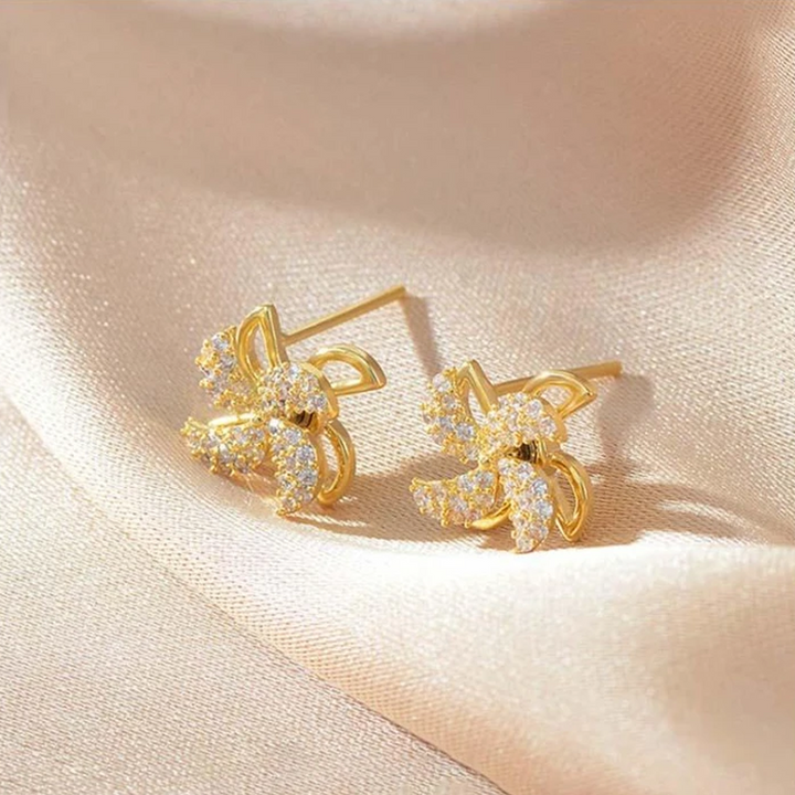 "Eleganta roterande väderkvarnörhängen i koppar och zirkon för kvinnor, gyllene eller silver, 1,1 cm, unika design."