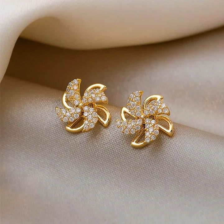 "Eleganta roterande väderkvarnörhängen i koppar och zirkon för kvinnor, gyllene eller silver, 1,1 cm, unika design."