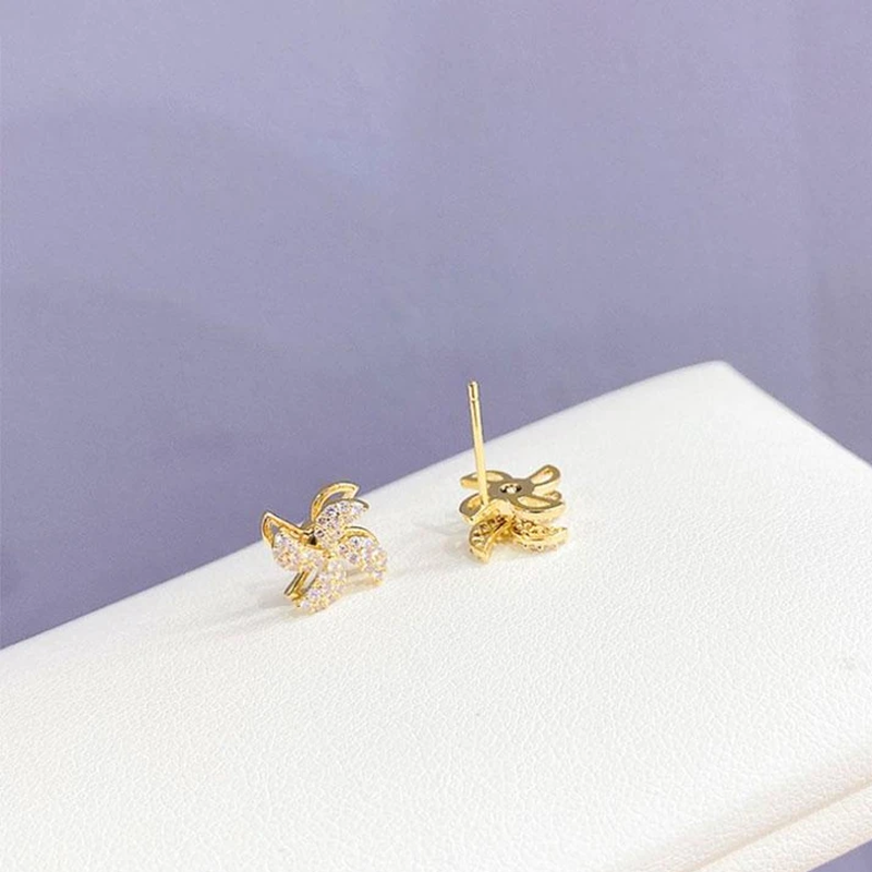 "Eleganta roterande väderkvarnörhängen i koppar och zirkon för kvinnor, gyllene eller silver, 1,1 cm, unika design."