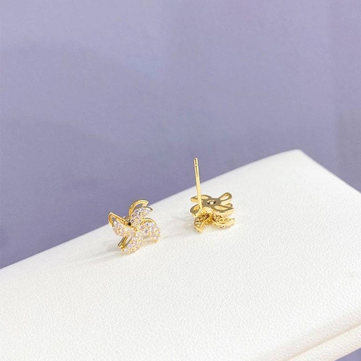 "Eleganta roterande väderkvarnörhängen i koppar och zirkon för kvinnor, gyllene eller silver, 1,1 cm, unika design."