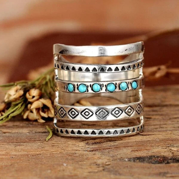 "Eleganta silver damring med stjärna, måne och sol-design, perfekt accessoar med glänsande yta för daglig användning."