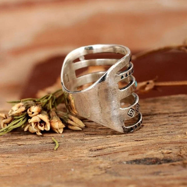 "Eleganta silver damring med stjärna, måne och sol-design, perfekt accessoar med glänsande yta för daglig användning."