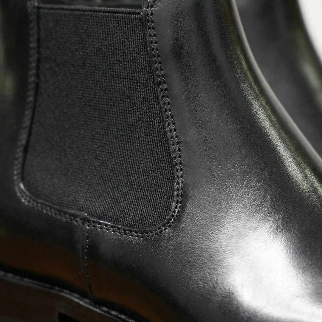 Smidiga instegsstövlar: svarta herr Chelsea boots, ankelhöga och bekväma vardagsskor med resår.