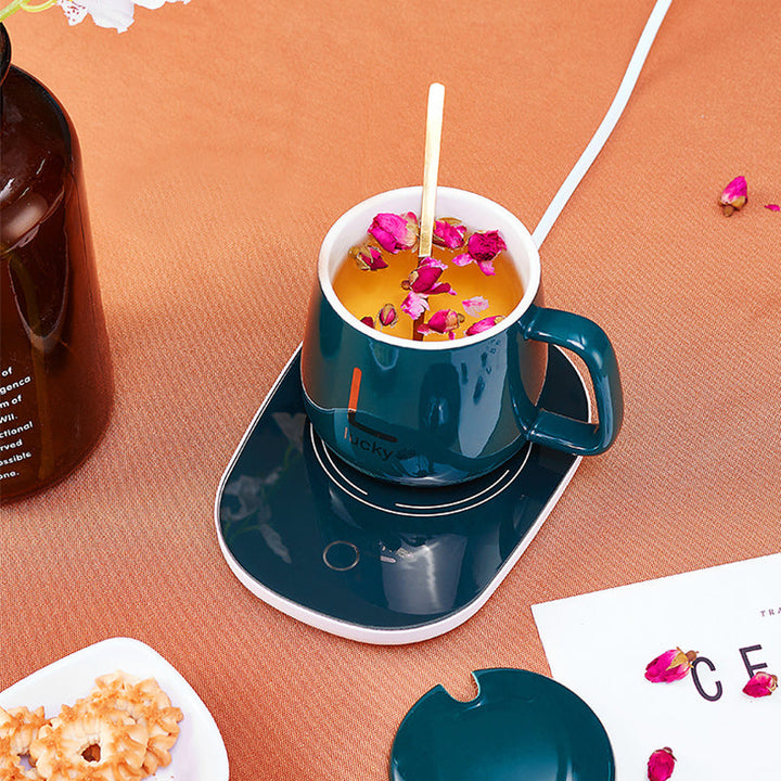 "Elektrisk kaffe-mjölkvärmare i vit och grön, temperaturkontroll, passar flatbottnade koppar, stilren och vattentät design."