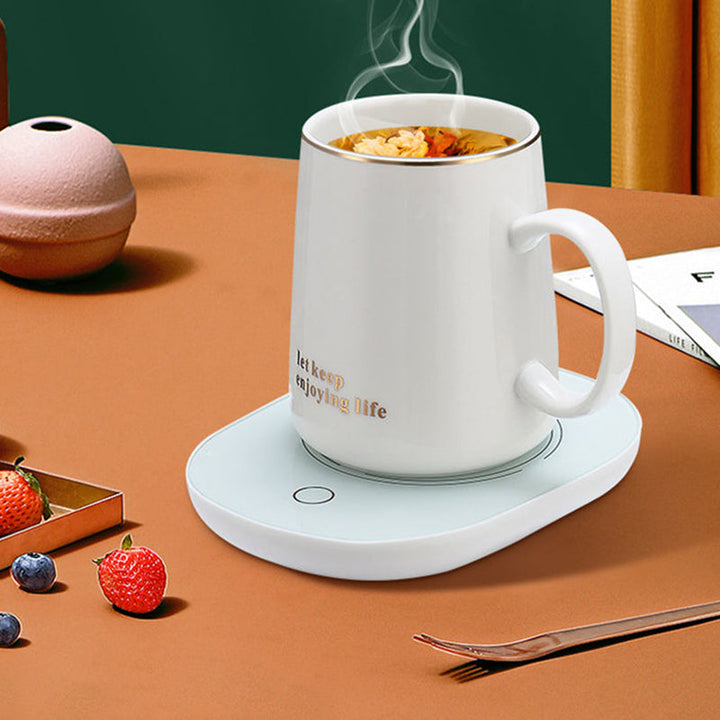 "Elektrisk kaffe-mjölkvärmare i vit och grön, temperaturkontroll, passar flatbottnade koppar, stilren och vattentät design."
