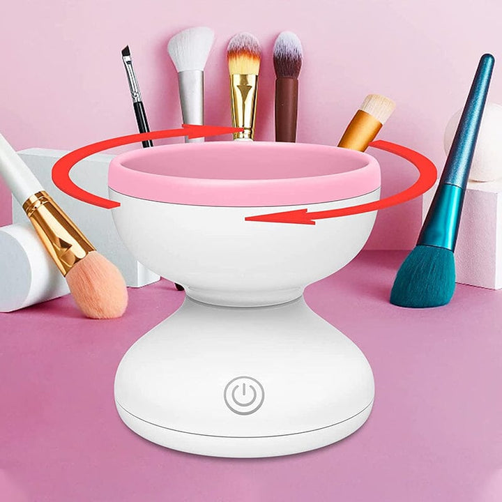 "Elektrisk makeupborstrengörare i rosa, kompakt med rund design, perfekt för effektiv borstvård på resor."