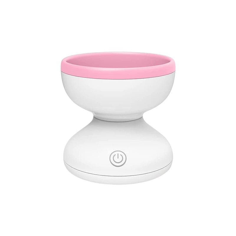 "Elektrisk makeupborstrengörare i rosa, kompakt med rund design, perfekt för effektiv borstvård på resor."