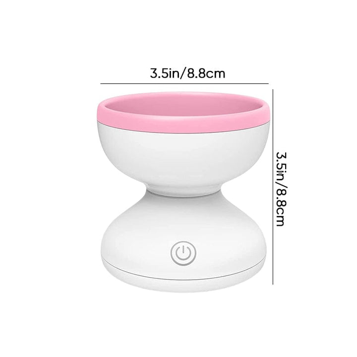 "Elektrisk makeupborstrengörare i rosa, kompakt med rund design, perfekt för effektiv borstvård på resor."