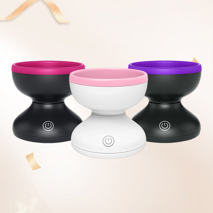 "Elektrisk makeupborstrengörare i rosa, kompakt med rund design, perfekt för effektiv borstvård på resor."
