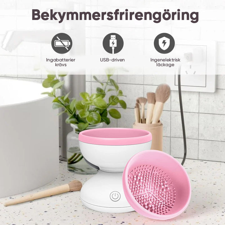 "Elektrisk makeupborstrengörare i rosa, kompakt med rund design, perfekt för effektiv borstvård på resor."