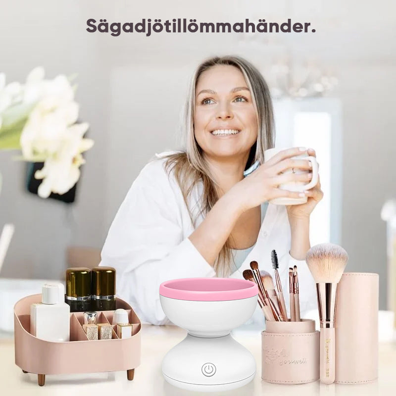 "Elektrisk makeupborstrengörare i rosa, kompakt med rund design, perfekt för effektiv borstvård på resor."