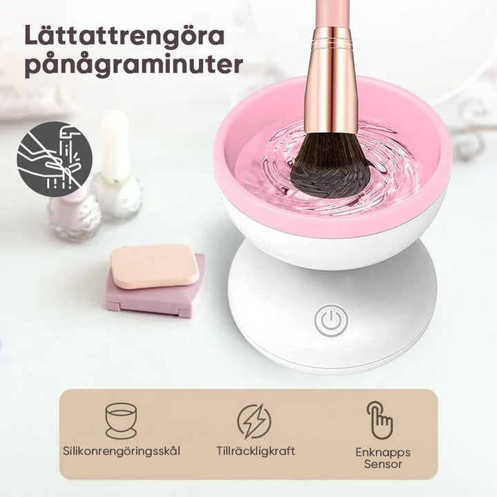 "Elektrisk makeupborstrengörare i rosa, kompakt med rund design, perfekt för effektiv borstvård på resor."