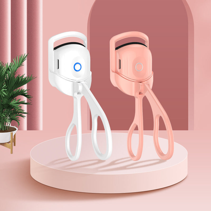 "Elektrisk ögonfransböjare i rosa med temperaturkontroll, ger perfekt böjda fransar. Idealisk för skonsam och effektiv använd