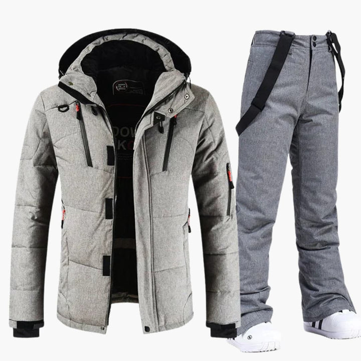 Närbild på material i herr skidjacka & skidbyxor; slitstarkt, vattentätt skidset för vinterkläder och snölek.