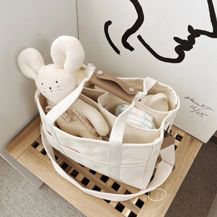 "Enfärgad dam tygkasse i robust canvas, med breda handtag och stor kapacitet. Perfekt som chic och hållbar väska."