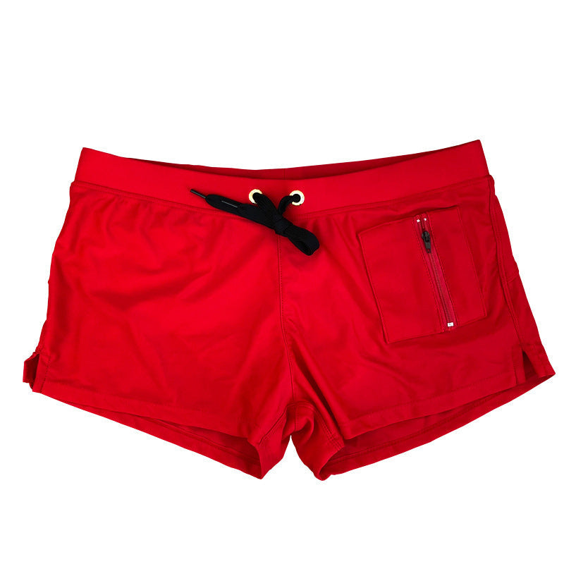 "Enfärgade andningsbara herrbadbyxor i nylon, visa elegant design, perfekta för strand och pool, flera färger."