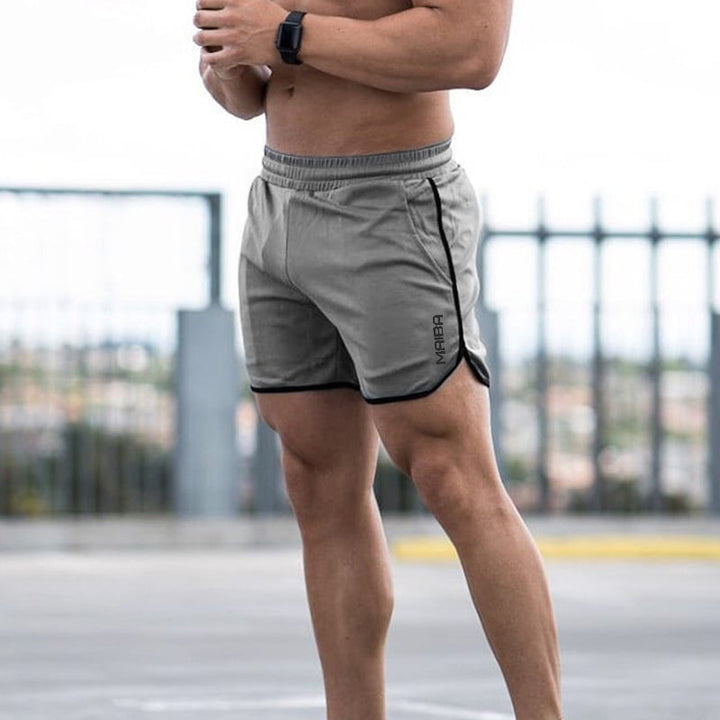 "Enfärgade monogram herr sportshorts i bomull, modern design med eleganta detaljer, idealiska för träning och vardag."