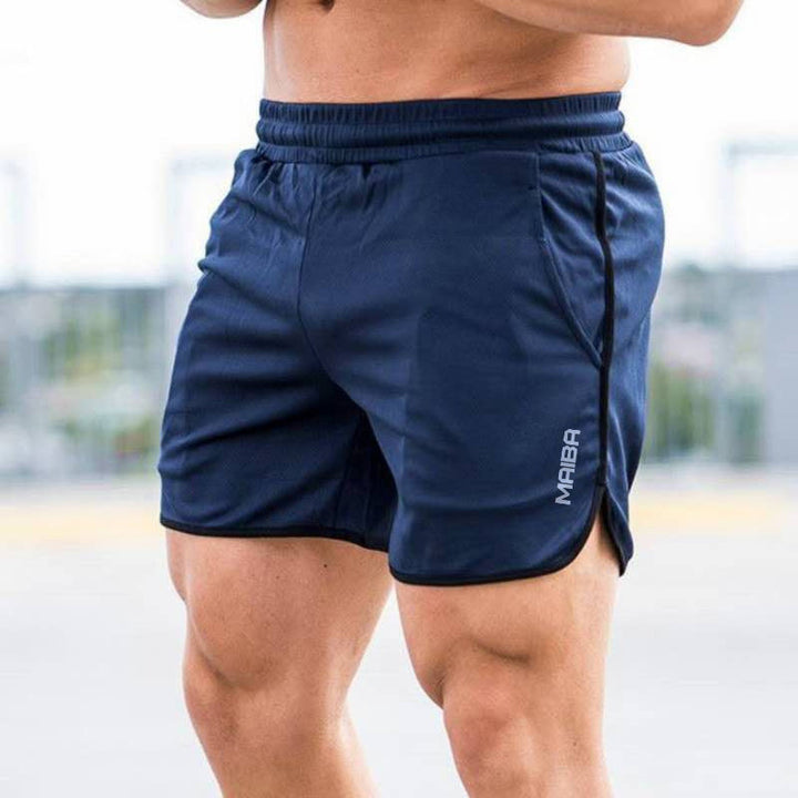 "Enfärgade monogram herr sportshorts i bomull, modern design med eleganta detaljer, idealiska för träning och vardag."