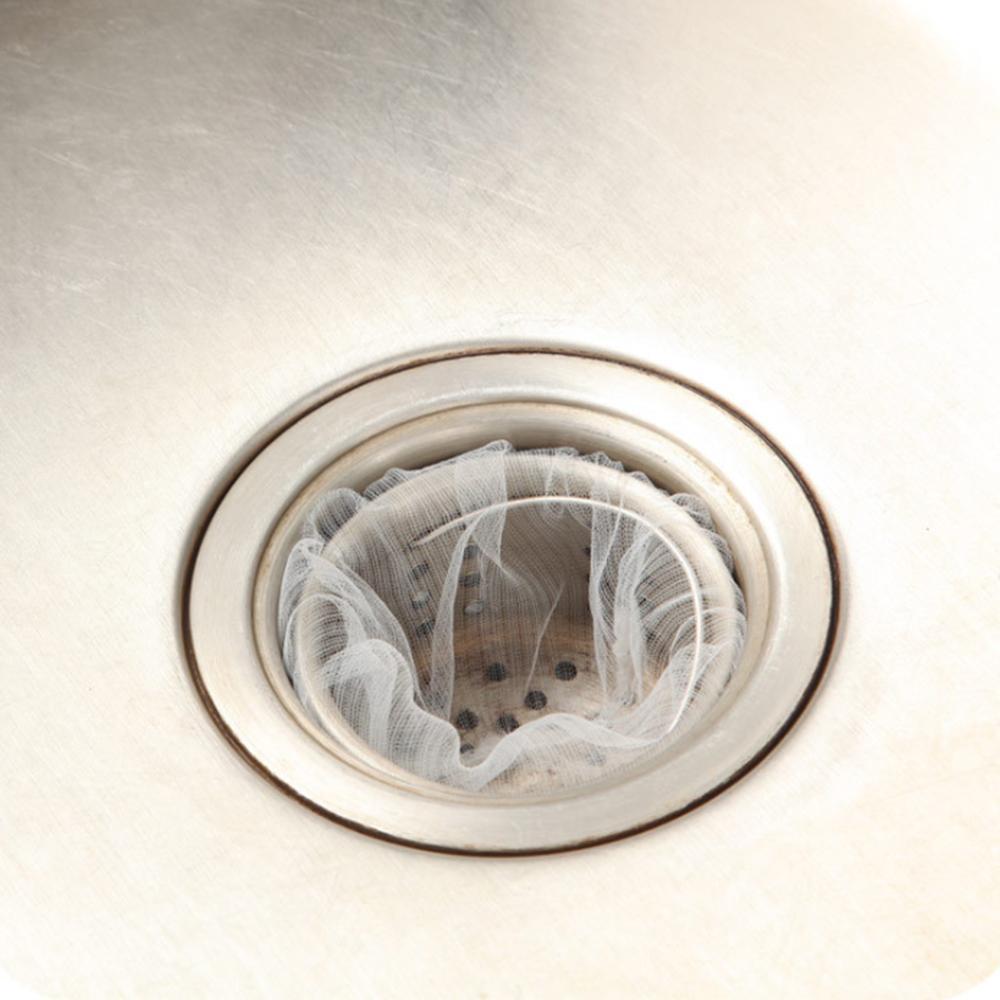 "Engångs nätpåse i filter, vit nylonnät, fångar små matrester, passar de flesta diskbänksfilter, enkel installation."