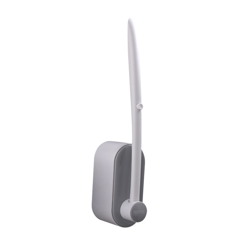 "Engångstoalettrengöringssystem med havsdofter, svartvit stav med rengöringshuvud i ljusare nyanser, klar för användning."