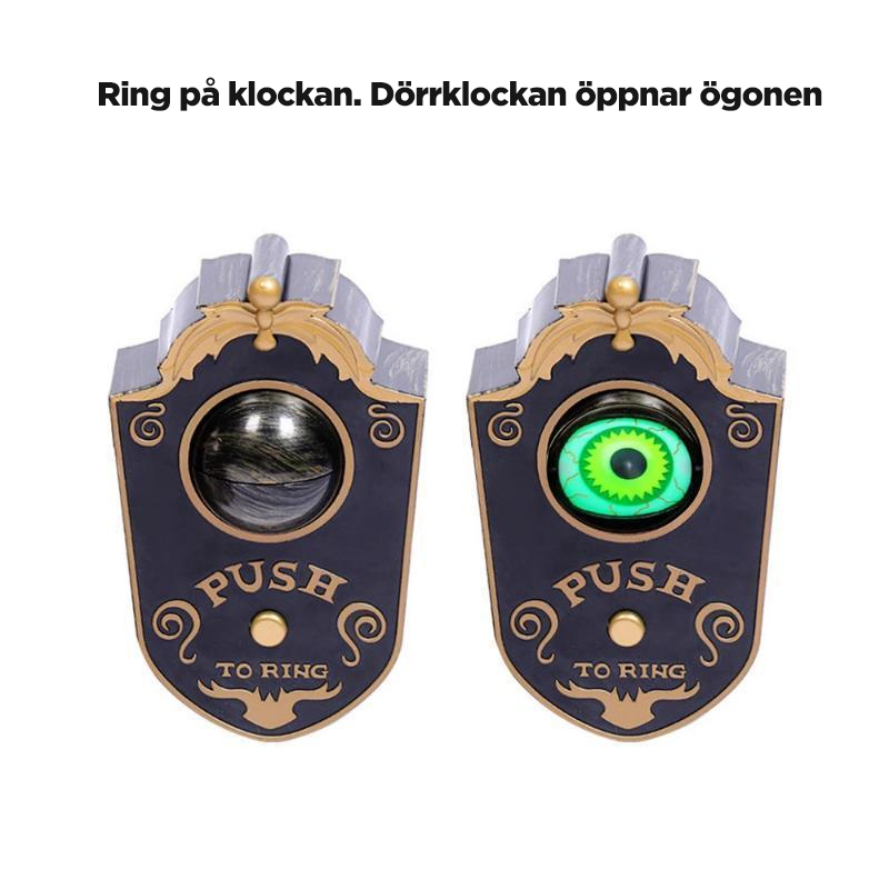 "Enögd dörrklocka i form av skrämmande öga med ljuseffekter, grå och svart plast, perfekt för Halloween-dekoration."