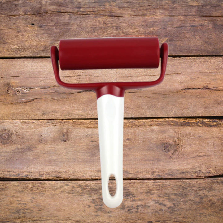 "Ergonomisk tårtglasyr-finisher i vitt, designad för jämna ytor. Perfekt för dekorering av bakverk i hemmakök."