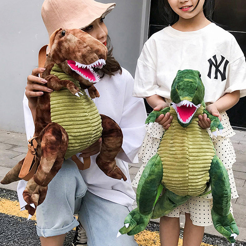 "Färgglad barnryggsäck formad som en dinosaurie, justerbar och vattentät med vadderad ryggpanel och meshtyg."