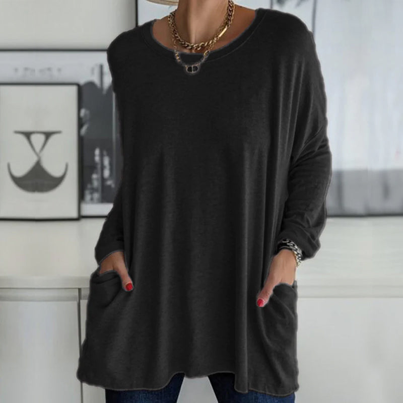 "Färgglad damtopp med lång ärm, rund hals och ficka, idealisk vardagslook. Finns i flera färger för stilvariation."