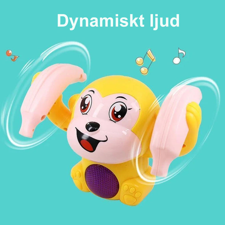 "Färgglad elektrisk tumlande apa leksak för barn som spelar musik och lyser upp, säker och lätt för små händer."