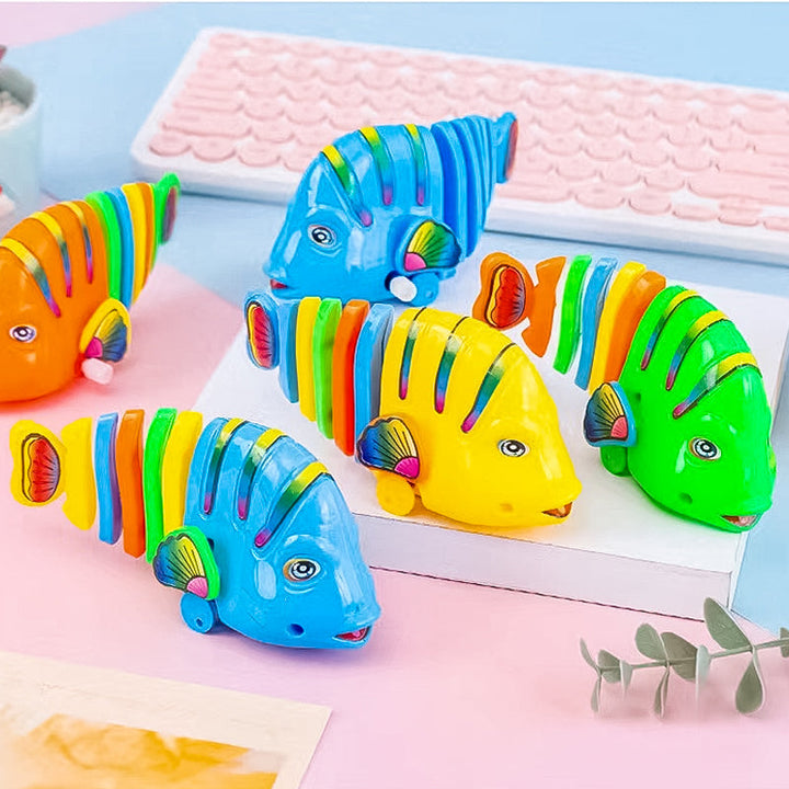 Färgglad fiskleksak för barn med livlig design, 360° rotation och säker plast. Perfekt för kreativ och rolig lek.