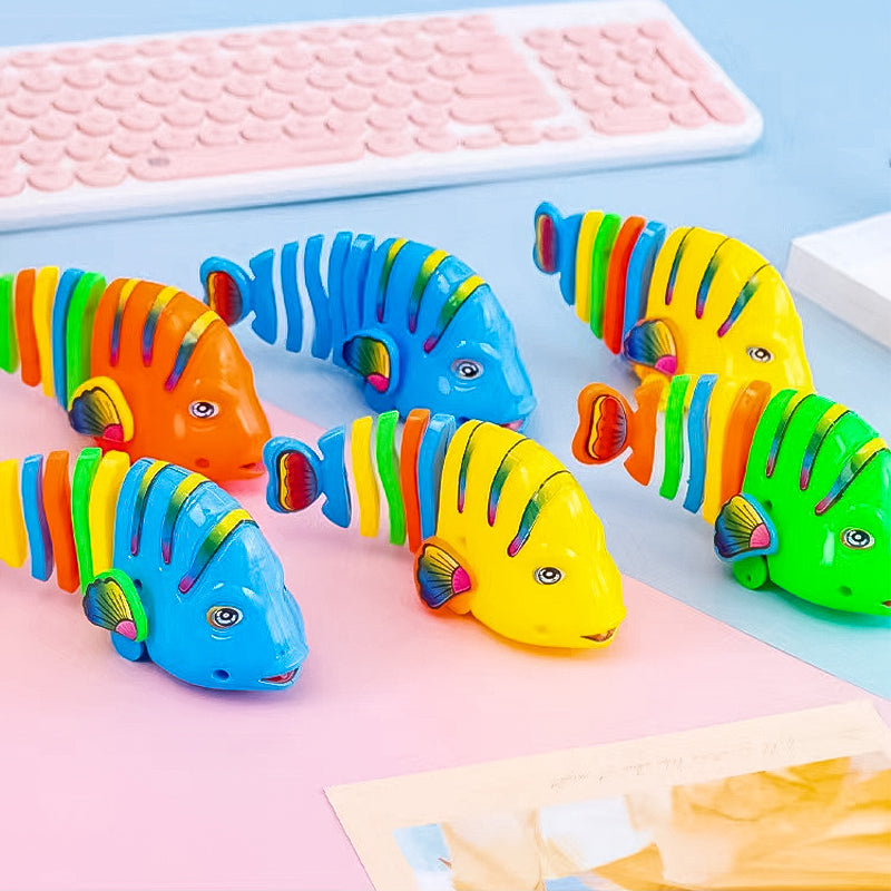 Färgglad fiskleksak för barn med livlig design, 360° rotation och säker plast. Perfekt för kreativ och rolig lek.