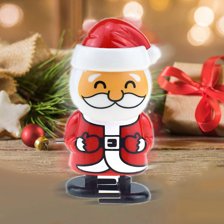 "Färgglad jul urverk leksak för barn, visar snögubbe och renmotiv, hoppar och springer utan batterier."