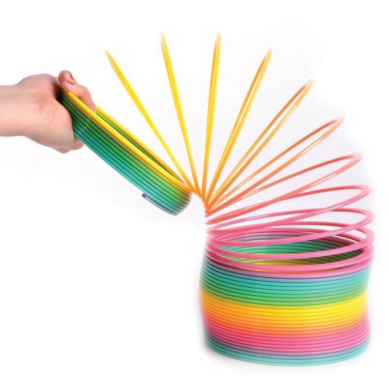 "Färgglad och flexibel regnbågsliknande leksak för barnfest, perfekt för kreativ lek och koordinationsträning."